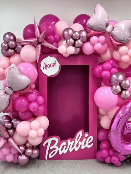Come on Barbie, let's go party. This Barbie-themed photo booth frame is perfect for a 6th birthday, with shades of pink, bows, and the classic Barbie logo.