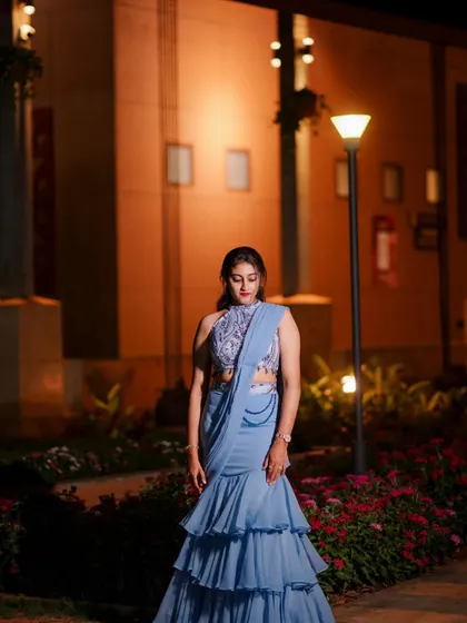 A front view of the powder blue ruffled half saree, showing the contemporary silhouette and design.