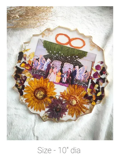 A 10-inch diameter agate frame featuring large preserved sunflowers and a wedding photo.