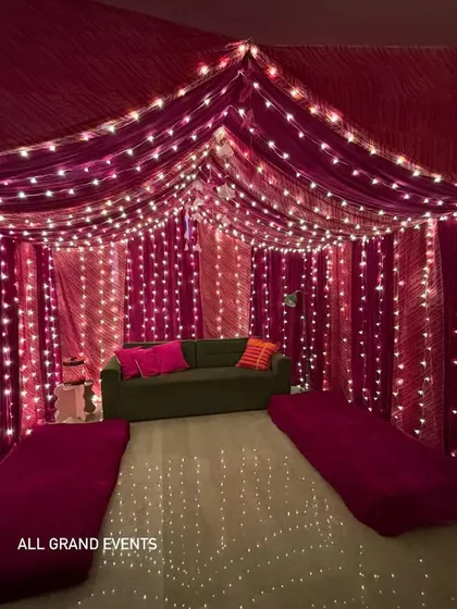 I can transform any room into a magical space. This home was turned into a cozy, festive tent using vibrant pink drapes, hundreds of fairy lights, and comfortable floor seating, perfect for a traditional function or an intimate party.