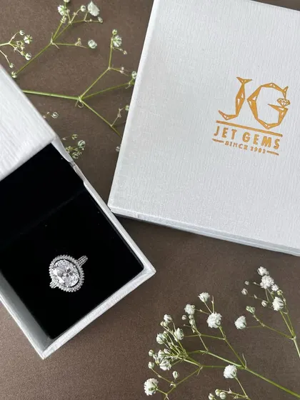 Where luxury meets sparkle. Our signature white box, tied with a ribbon, is the perfect home for a timeless diamond ring.