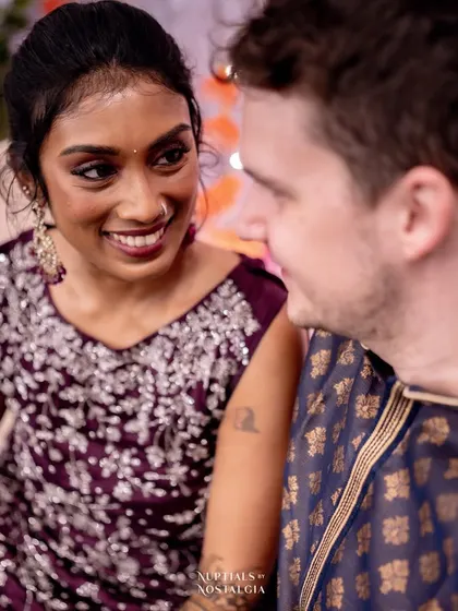 An intimate portrait of the couple, capturing their connection amidst the festivities.