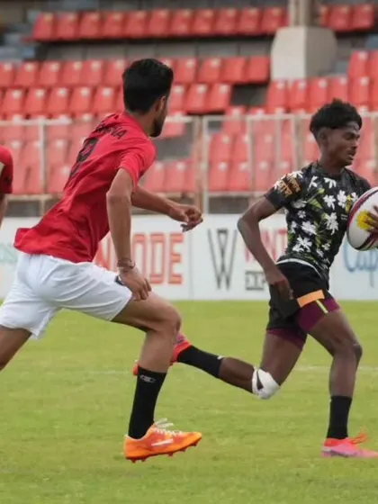 A player sprints down the field, ball in hand. The speed and agility required for rugby make it an exciting sport that builds incredible athleticism.