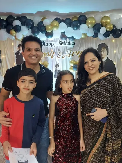 A lovely family photo taken at a birthday party we organized. Our goal is to create a stress-free environment where families can relax and enjoy these precious moments together.