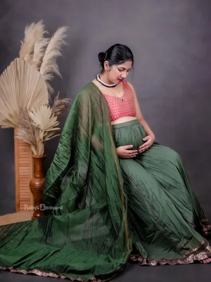 A quiet moment of connection with her baby. This studio portrait, with its earthy tones and textures, has a wonderfully warm and gentle feel.
