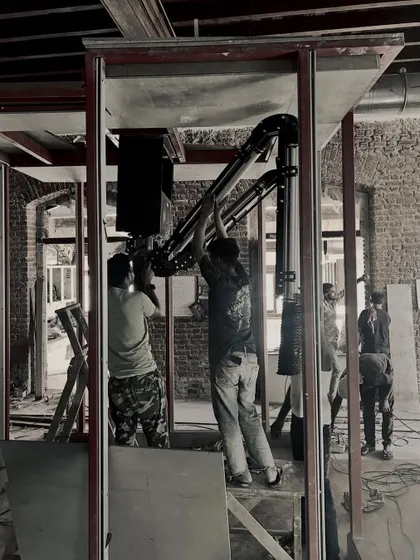 Our team on-site, carefully installing technical equipment within the structural frame. This hands-on involvement ensures every detail aligns with the overall design intent.