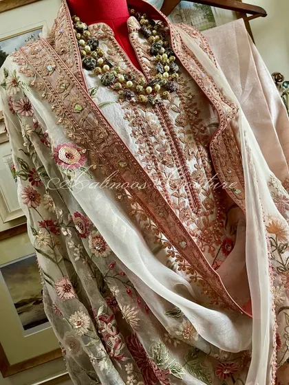 A full view of the styled suit, capturing its elegant silhouette.