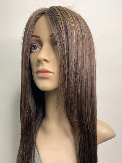 A side view of a highlighted mono base hairpiece. The combination of a natural-looking base and custom color creates a truly personalized and flawless result.