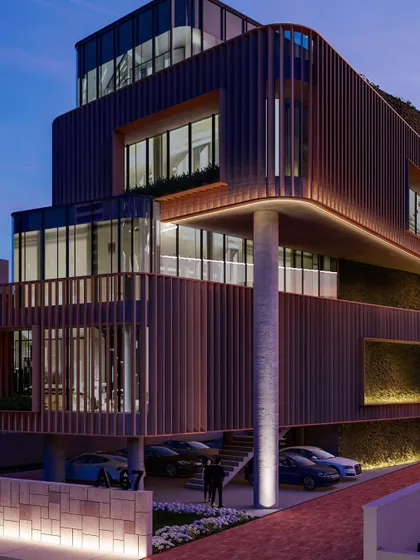 A render of the Jenga-inspired office building at dusk. The integrated lighting highlights the unique architectural form, showcasing how the building transforms into a dramatic sculptural element at night.