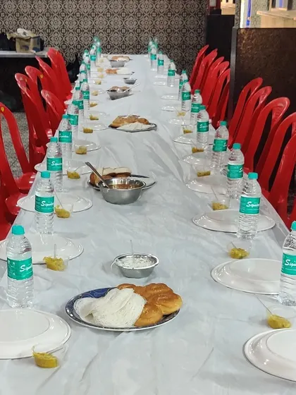 A simple yet elegant table setup at Amber Party Hall. Even for smaller gatherings, we ensure the presentation is clean and inviting, with neatly arranged plates and refreshments.