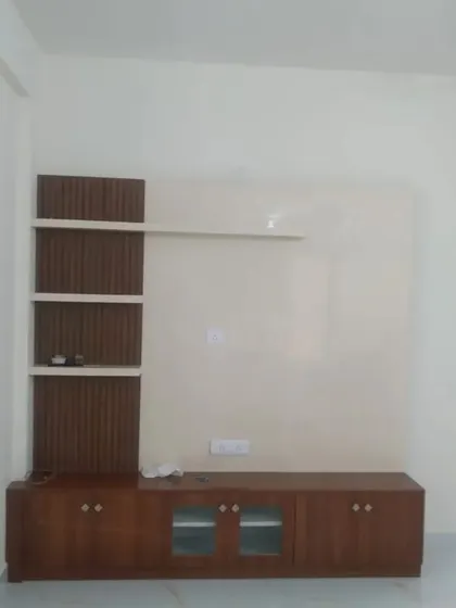 The wall behind this media unit has been painted in a soft, neutral color, providing a perfect backdrop that doesn't distract from the screen.