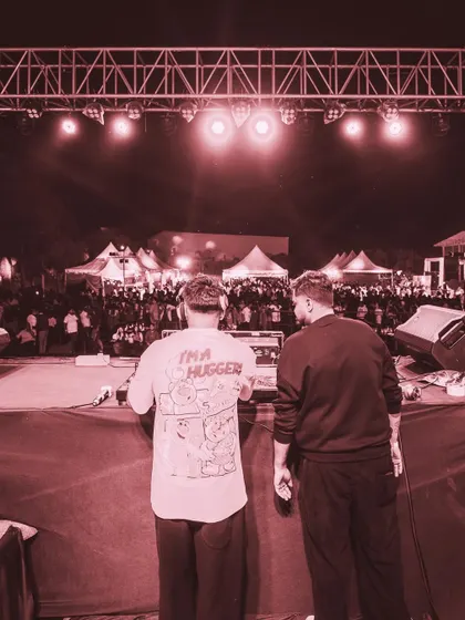 The view from behind the decks, looking out at a sea of people at a music festival. There's no feeling like controlling the energy of a crowd this size.