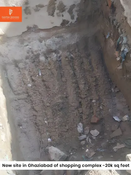 A top-down view of the excavation pit. This is where the foundation of the shopping complex will be laid, a crucial stage that we manage with precision and care.