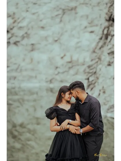 An intimate embrace by the quarry lake, with the couple dressed in matching black. The moody lighting and dramatic setting create a powerful portrait.