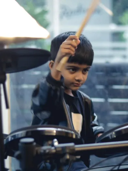 A young drummer in action during the student recital. It's amazing to see so much rhythm and passion from our youngest musicians.