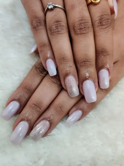 A full set of the milky lavender nails with a glitter accent. This is a great example of a simple yet sophisticated look.