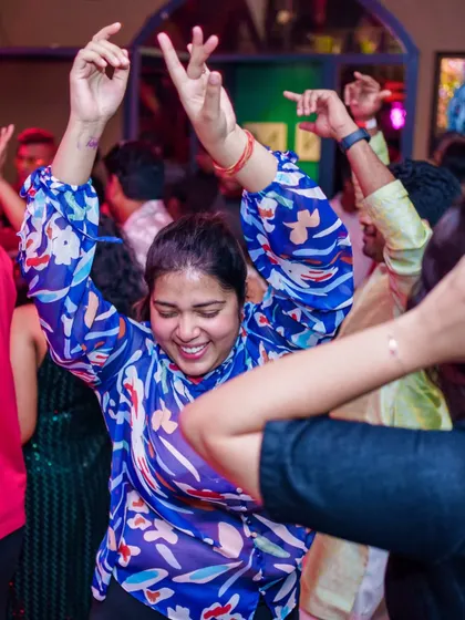 A guest dancing with abandon on the floor.