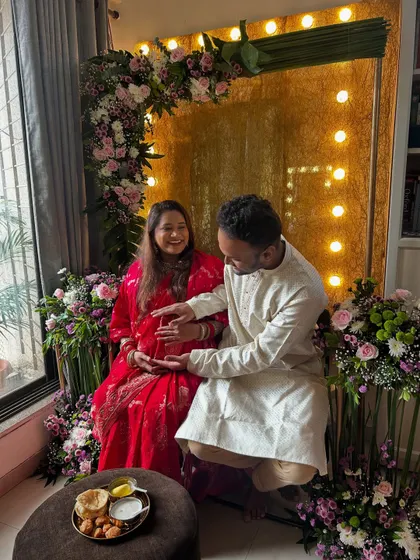 A candid moment during the baby shower rituals. It's all about celebrating with family and loved ones.