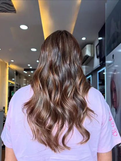 Serving smooth beige chocolate realness. This balayage combines cool beige tones with a rich chocolate base for a stunning result.