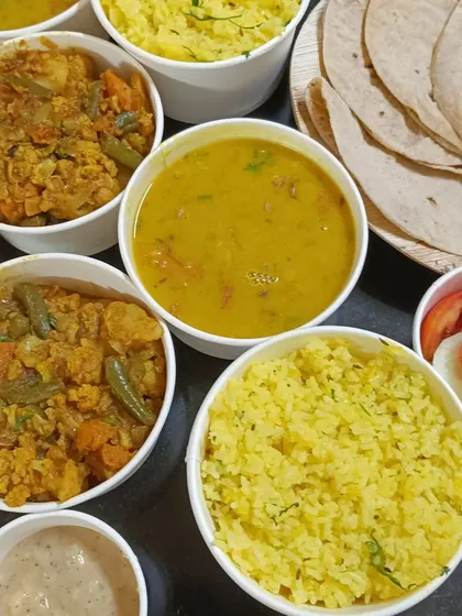A closer look at our trial meals, showcasing the vibrant colors and fresh ingredients. You can see the texture of the lemon rice, the chunks of vegetables in the sabzi, and the creamy dal.