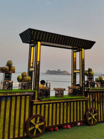 A refreshing coconut water station set against a stunning sea view, perfect for daytime or outdoor events.