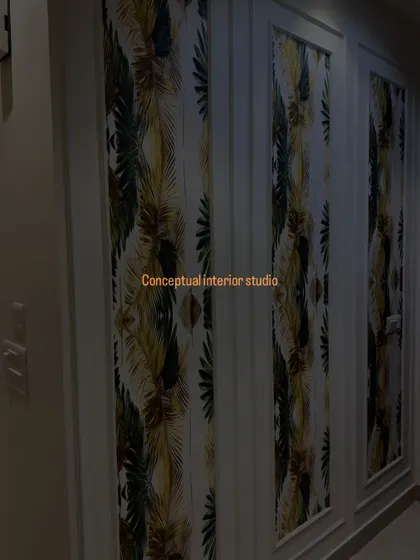 This wardrobe features custom wallpaper panels framed with molding, turning a simple storage unit into a piece of art.