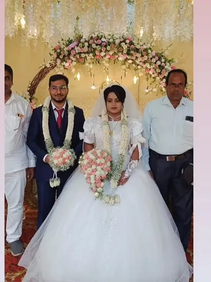 Rachel and her partner on their wedding day. The grandeur of her voluminous ball gown makes for a truly memorable and picture-perfect moment.