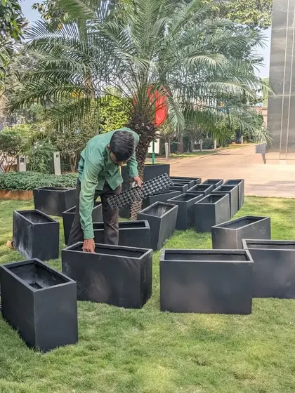 I am placing a drainage cell at the bottom of an FRP planter. This is part of our multi-layer base system to ensure excellent water drainage and prevent root rot.