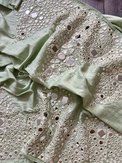 A view of the palazzo fabric, showing the texture and shimmer of the mirrorwork.