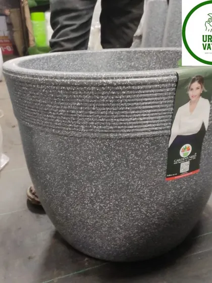 A D-shaped fiber pot, perfect for placing against a wall.