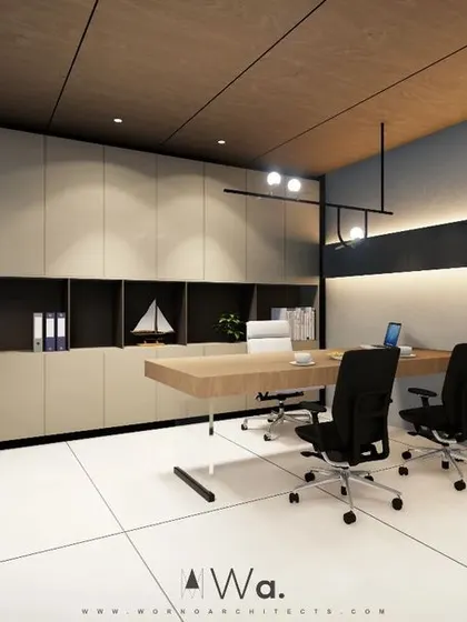 Another view of the Director's Office, showing the ample storage integrated seamlessly into the wall. The combination of wood, neutral tones, and a touch of greenery results in a modern and uncluttered executive space.