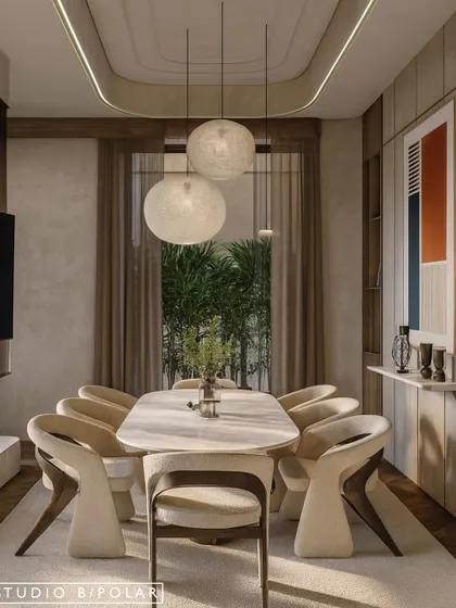 The dining space is illuminated by beautiful pendant lights that add a soft, ambient glow. The curved lines of the ceiling detail, chairs, and table create a harmonious and visually pleasing composition.