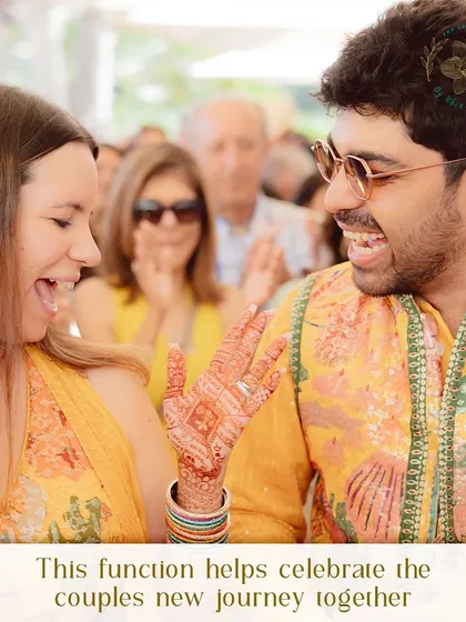 A candid moment of laughter between the couple during their Haldi ceremony. This function is all about celebrating their new journey together with joy and blessings from loved ones.