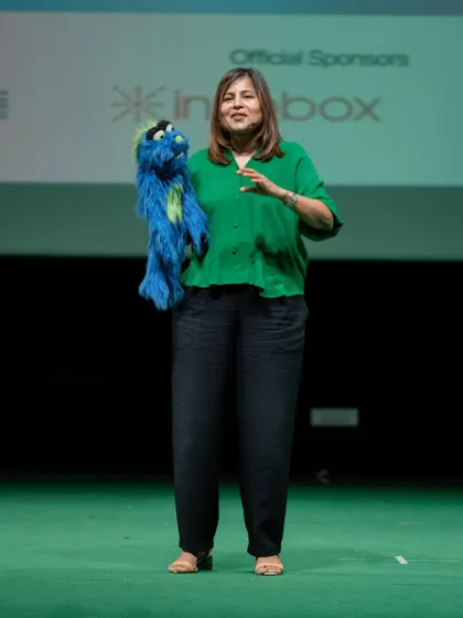 Sharing the stage with my puppet during a motivational talk. This combination of speaking and entertainment is what makes my sessions stand out at corporate functions and offsites.