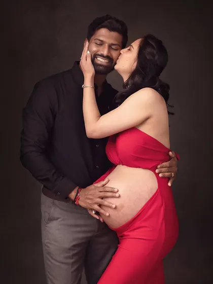 A playful and loving kiss. This image captures the fun and passionate side of their relationship during this special time.