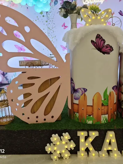 A close-up of the butterfly wing prop and custom pedestal.