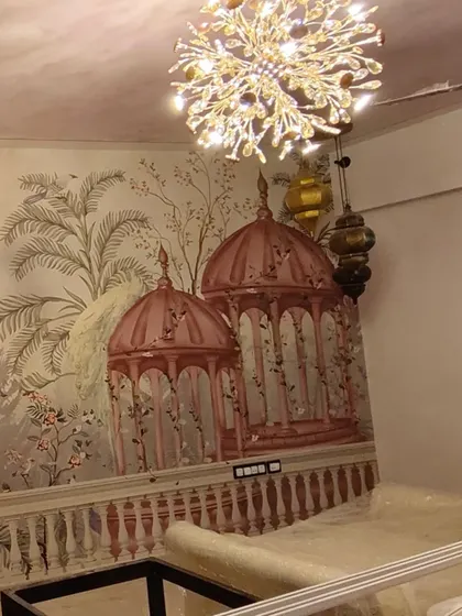 This shot shows the mural under different lighting, highlighting the texture of the canvas and the beautiful chandelier in the room.