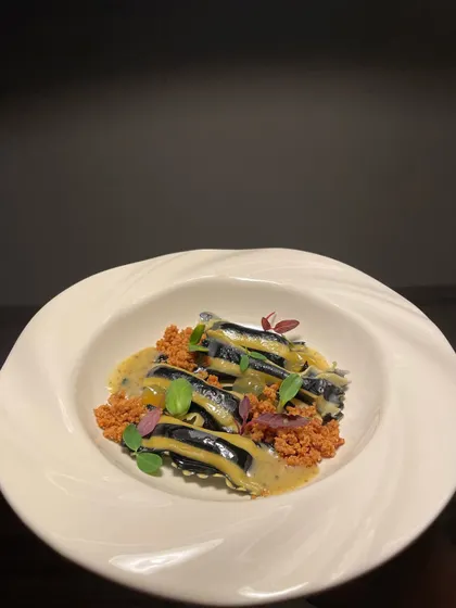 My signature Agnolotti Di Patate. These pillowy, handmade pasta pockets are filled with potato and served with an edamame and saffron seaweed butter, finished with a malt milk crumble for texture.