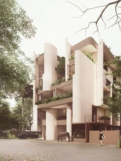 The Nest, located in Panjim, is designed to be a nested world within itself. The facade is characterized by soft, curved fins that create recessed vertical courtyards, providing privacy, shade, and passive cooling.