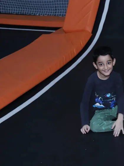 Taking a short break from all the jumping. The soft padded edges of our trampolines provide a safe place to rest.