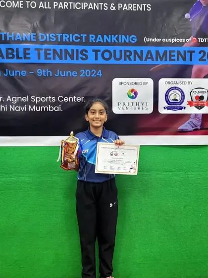 Mahika Susvirkar with her runner-up trophy and certificate in the U-11 category at the District Tournament Ranking.