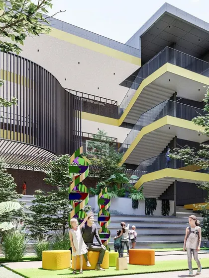 A rendering of the Basil School courtyard in Hyderabad, an ISKCON initiative for holistic learning. The design centers around this social hub, with open-air staircases and green spaces fatores for interaction and play.