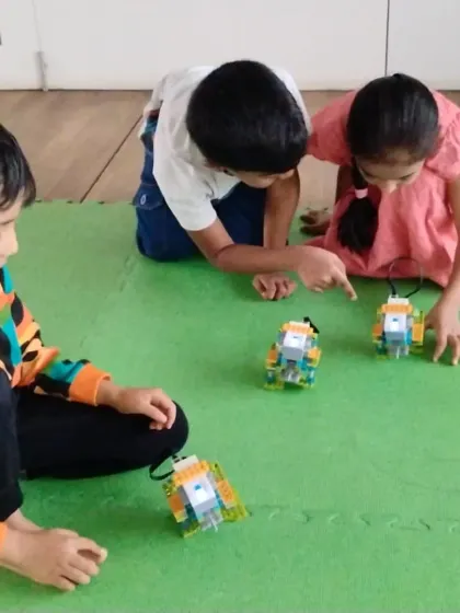 Three young engineers testing out their robotic creations. Our camps for ages 6-11 are available across seven locations in Bangalore.