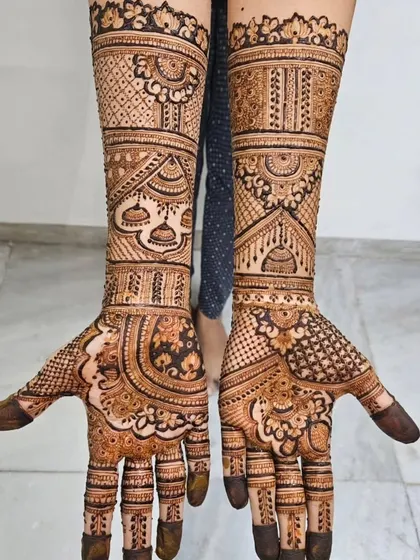 The same bridal design from a different perspective, showing how the patterns wrap around the hands and arms.