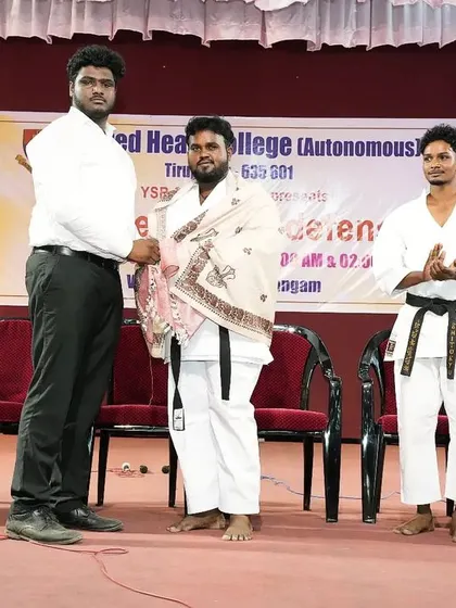 A moment of appreciation on stage. I was happy to be felicitated during the women's self-defense program, and I am thankful for the warm welcome.