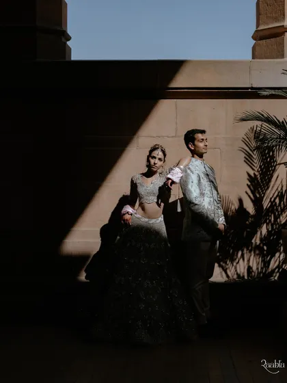 A play of light and shadow at Umaid Bhawan Palace. This artistic portrait of Amala and Aditya uses dramatic lighting to create a moody and powerful image.
