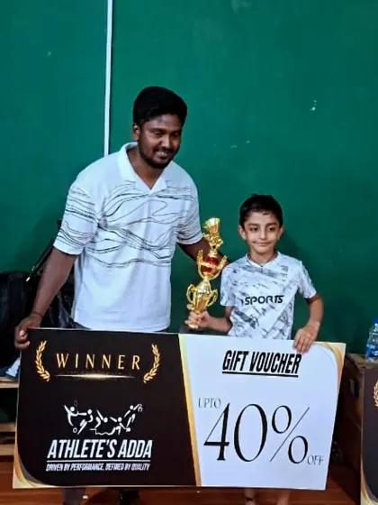 Champion alert. Trayaaksh celebrates his incredible victory in the Boys' Singles U9 category at the WOF Biggest State Open Cash Prize Tournament.