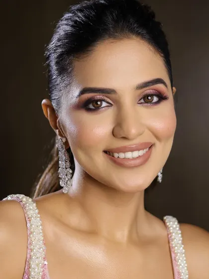 This portrait shows how the pink tones in the makeup complement the skin, creating a healthy, radiant glow.