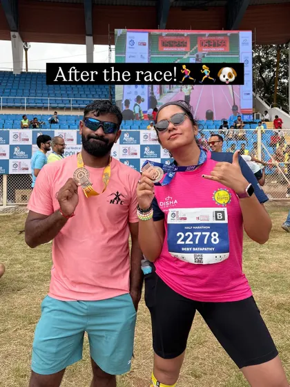After the race, celebrating with a fellow runner and our hard-earned medals. The post-race feeling is always a mix of exhaustion and pure joy.