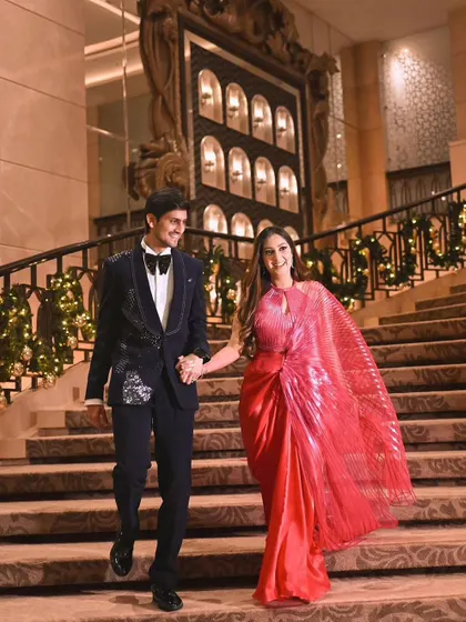 The couple making a grand entrance down the stairs.